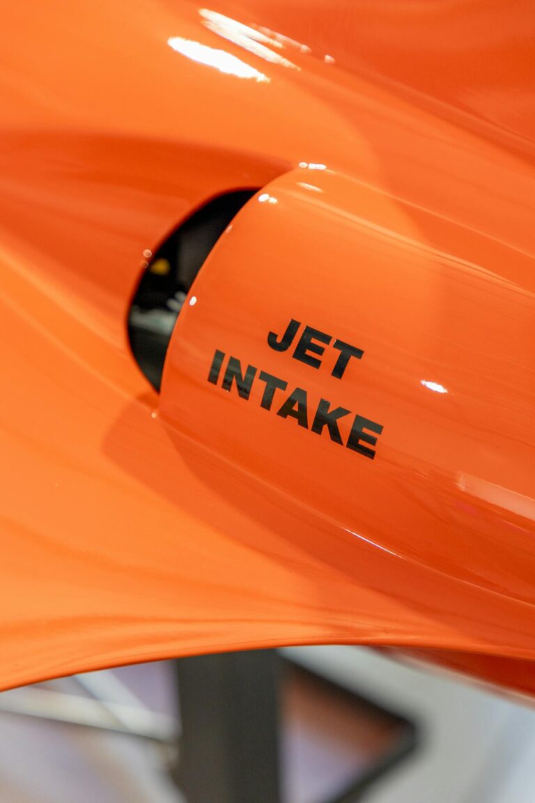 Close view of an orange jet intake with visible text 'JET INTAKE'.